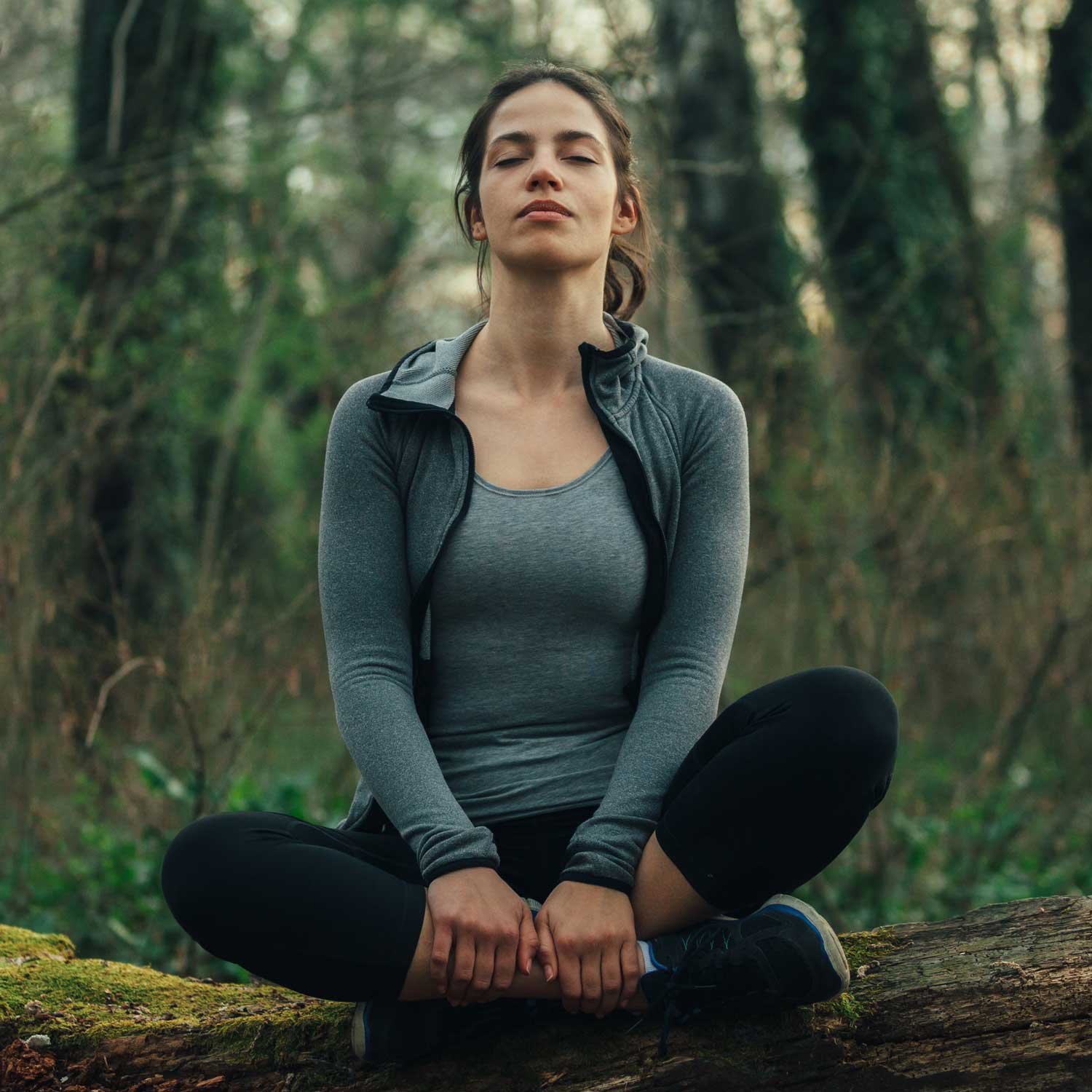Woman meditates while thinking about her decision to pursue treatment after a miscarriage | Ember Fertility Center | Laguna Hills & Orange County, CA